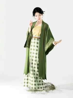 Song Dynasty modern hanfu full set with moss green Changgan Temple beizi pale yellow camisole and geometric spiral wrap skirt shown from the front three-quarter view