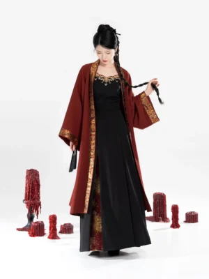 Full-body front view of a Song Dynasty modern hanfu set with dark red beizi jacket, black camisole, gold trim, and long pleated skirt