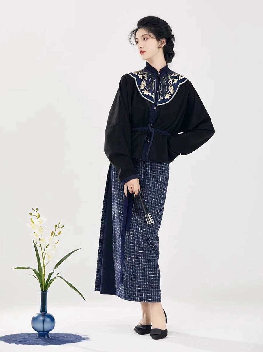 Song Dynasty inspired modern hanfu set with embroidered stand collar top and wrap skirt styled with a traditional folding fan