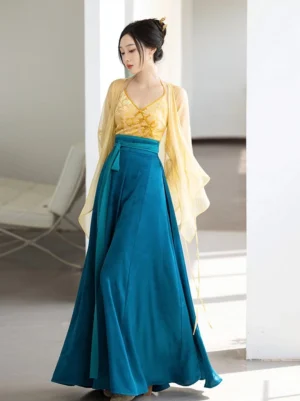 Full front view of Song Dynasty inspired Night Banquet Hanfu set with sheer yellow cardigan gold halter camisole and teal ten-panel skirt