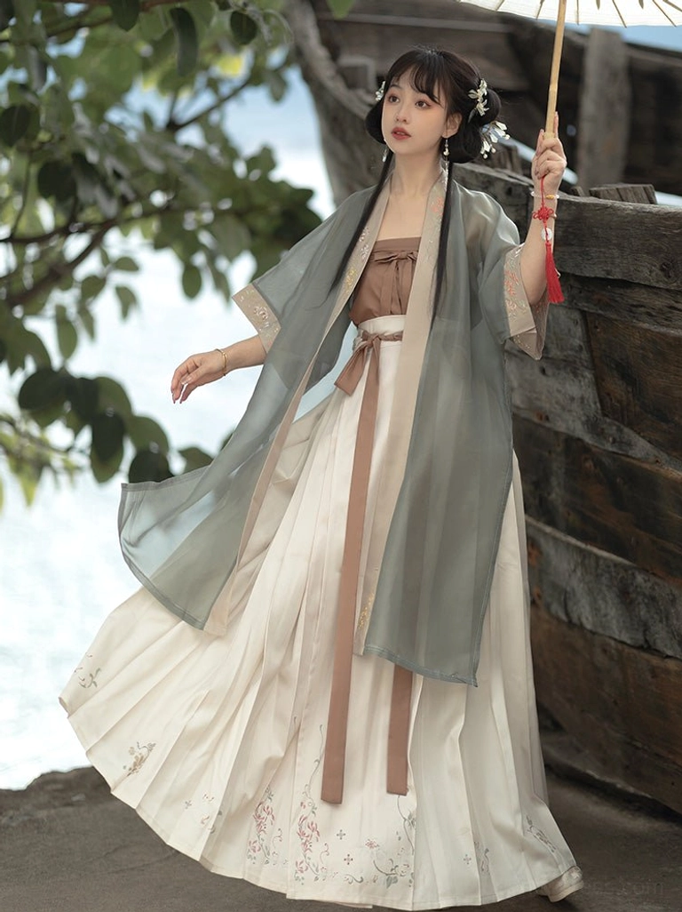 Side view of Song Dynasty style Qiyao Ruqun Hanfu with dusty blue translucent beizi, pleated embroidered skirt and traditional oil paper umbrella