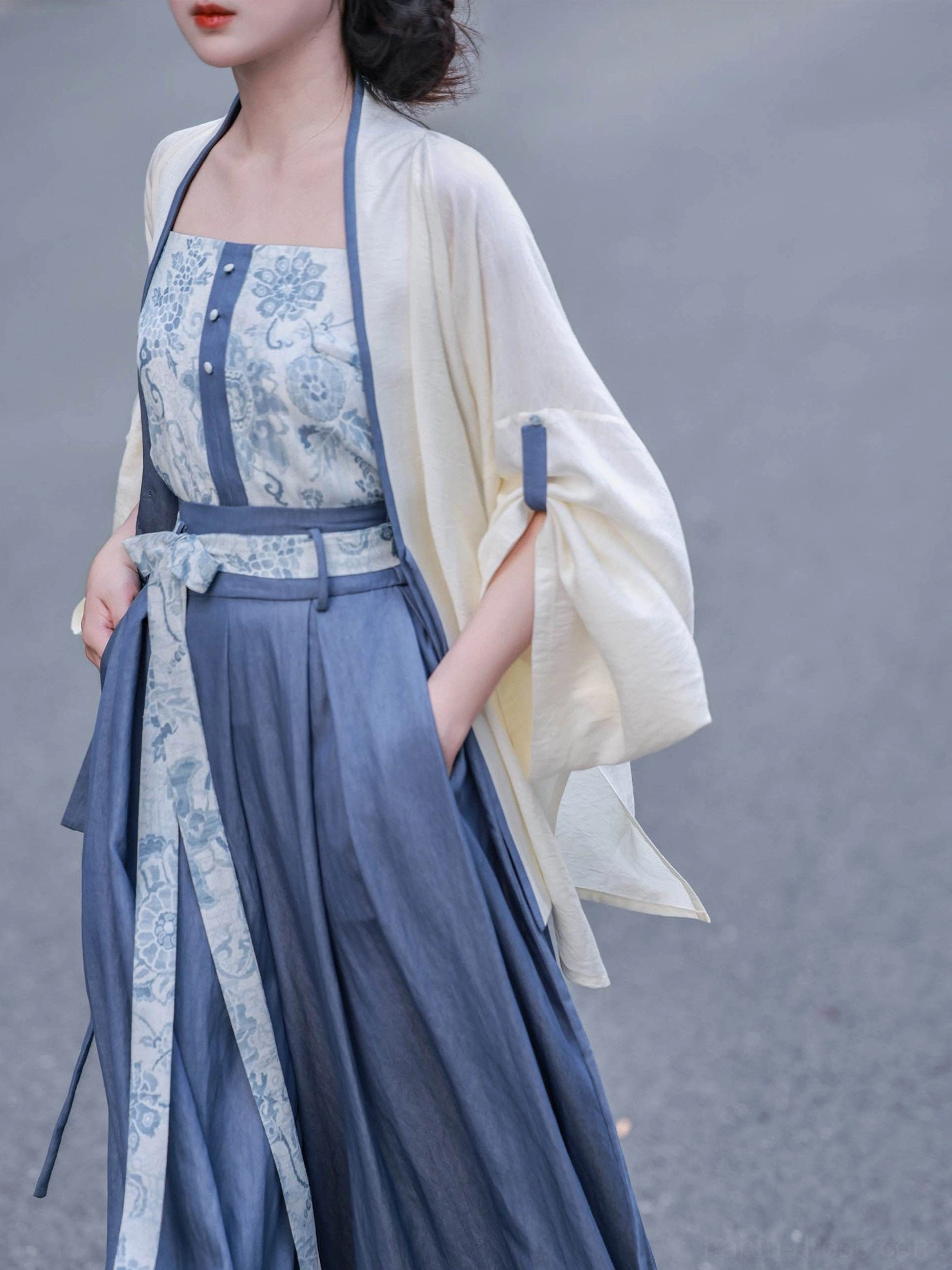 Modern Song Dynasty Hanfu outfit side silhouette with ivory split-sleeve cardigan and floor-length blue wide-leg pants