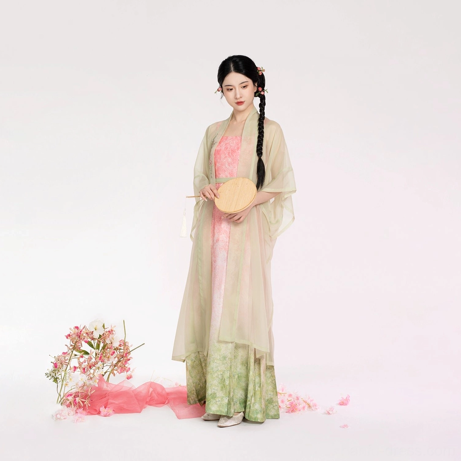 Full-body view of a woman wearing a modern Song-style Hanfu with floral hairpins, a long sheer beizi coat, and a soft gradient dress