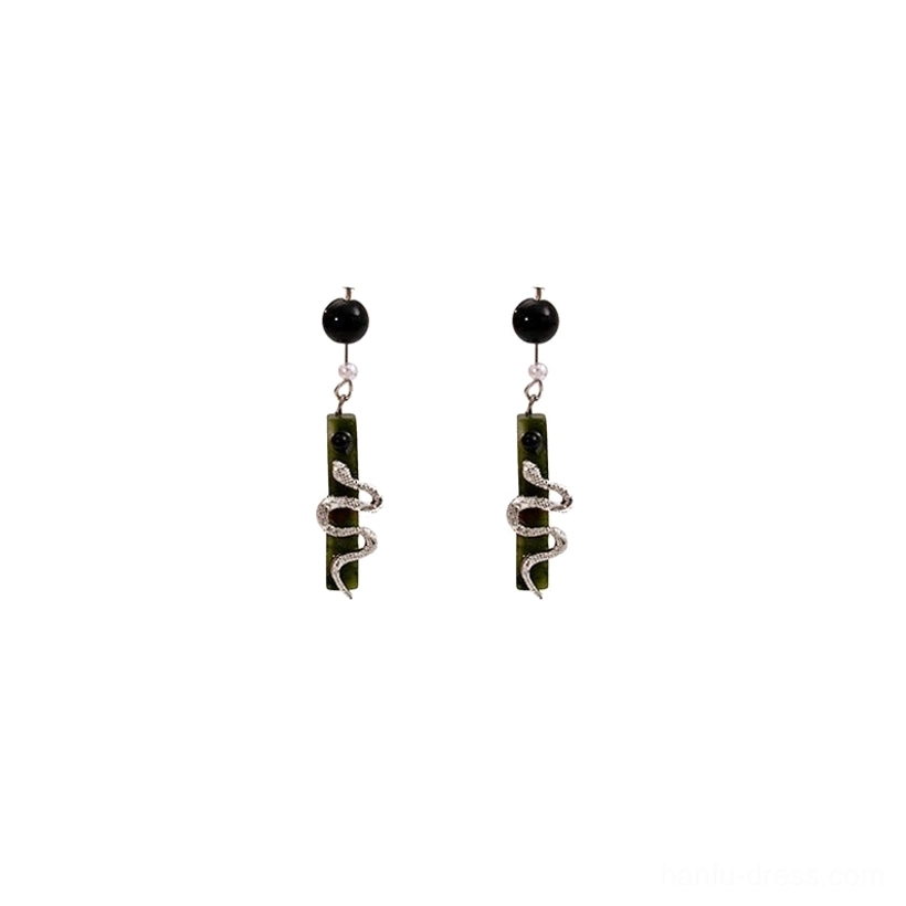 Front view of a pair of Spirit Snake Chinese earrings with sparkling silver snake details and deep green drop pendants