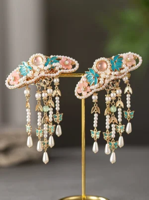 Pair of Spring Lane Hanfu tassel hair clips with pink flowers, blue green enamel style leaves, pearl chains and teardrop pendants