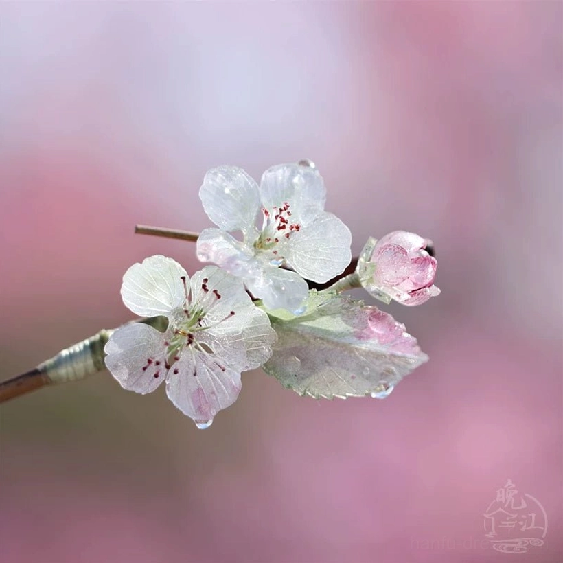 Close-up of translucent pink edged pear blossom decoration on Spring Rain Hanfu Chinese hair stick