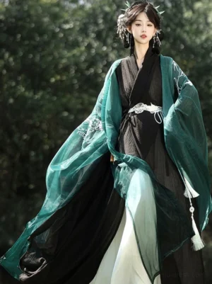 Star River Wei Jin Dynasty Hanfu set in dark green black and white with cloud embroidered wide sleeves and tassel waist accessory front three quarter view