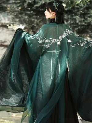Back view of Star River Wei Jin Dynasty Hanfu robe showing white dragon and cloud embroidery on the sheer dark green outer coat