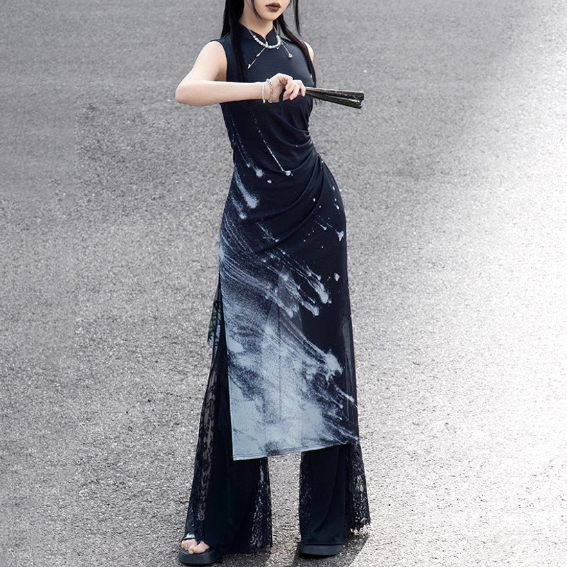 Low front angle of a woman posing in a starry Night Galaxy modern Hanfu dress with slim fit silhouette, stand collar, layered split skirt, and sheer lace trim