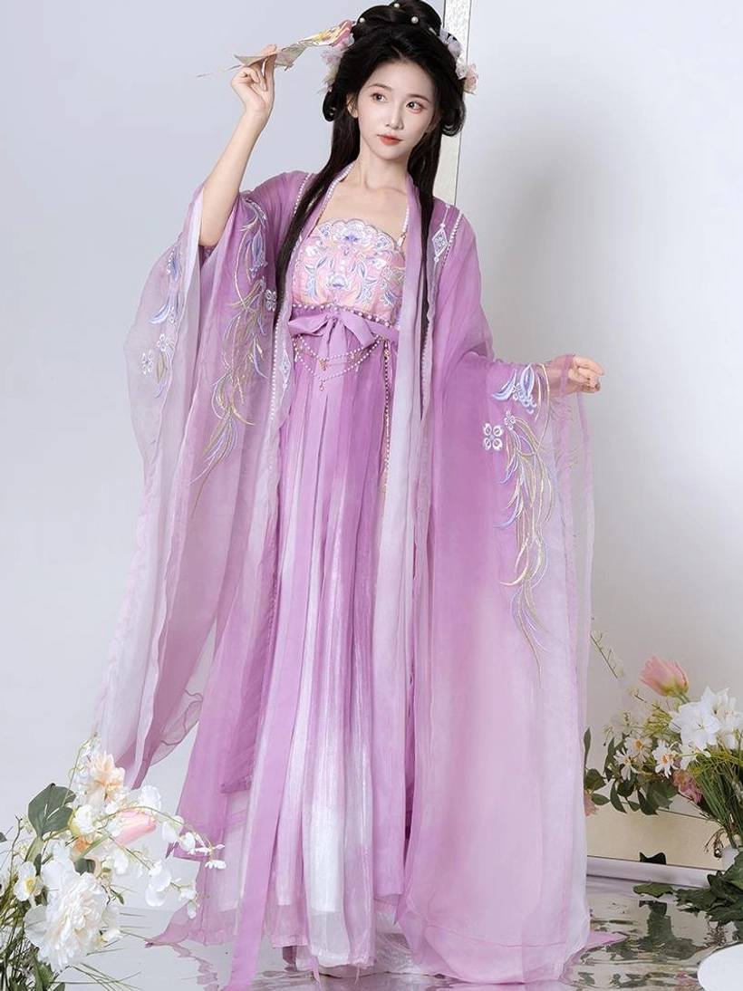 Light purple gradient Tang Dynasty Hanfu Heziqun dress set shown from the front with wide embroidered sleeves, flowing outer coat, floral details, and traditional Chinese hairstyle