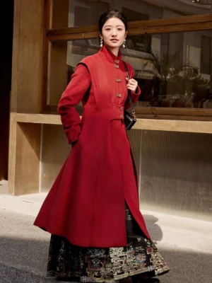 Red Sui'an modern Hanfu coat styled outdoors with a black patterned Hanfu skirt, stand collar, Chinese metal toggle buttons, hidden side pockets, and long A-line hem