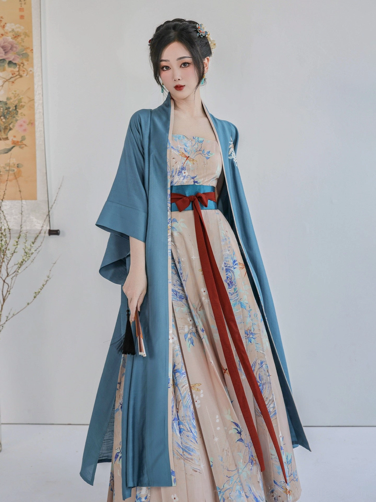 Full-body front view of the Summer Dream modern Song Dynasty Hanfu two-piece set with dusty blue Beizi jacket, printed apricot dress, teal belt, and red flowing sashes