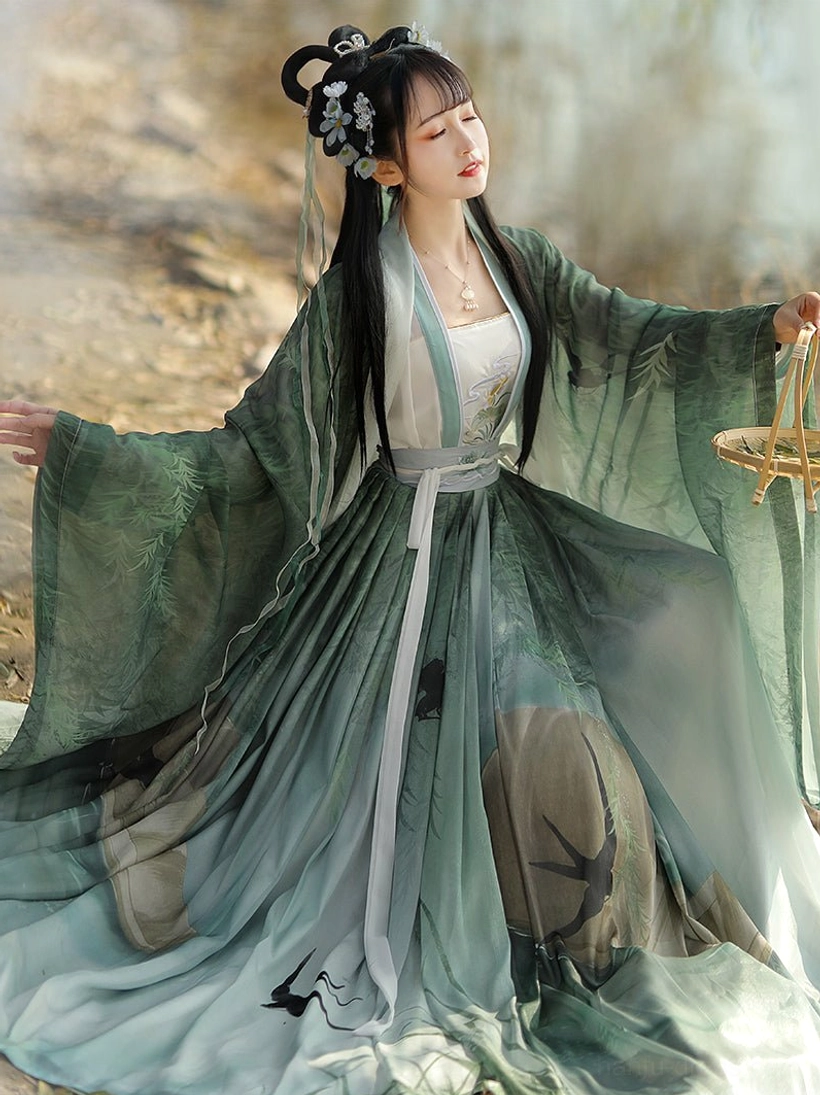 Green Swallow Flight Song Dynasty Qiyao Ruqun Hanfu complete set with gradient chiffon layers, flying swallow and Chinese landscape prints, wide sleeves, and matching waist sash worn beside misty willow water