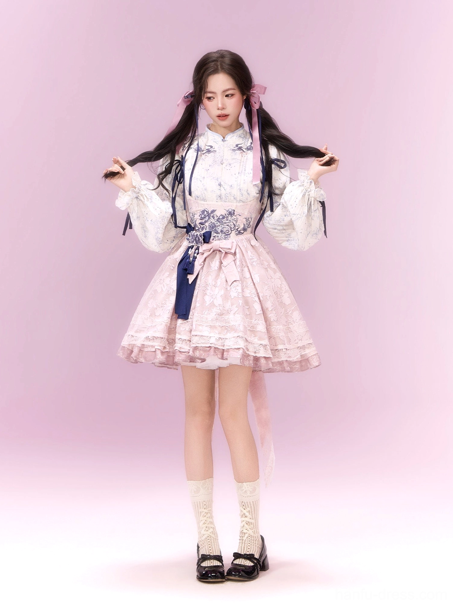 Sweet pink modern Hanfu xianxia Lolita dress set with floral Mandarin collar blouse, ruffled skirt, navy waist decorations, and pink hair ribbons