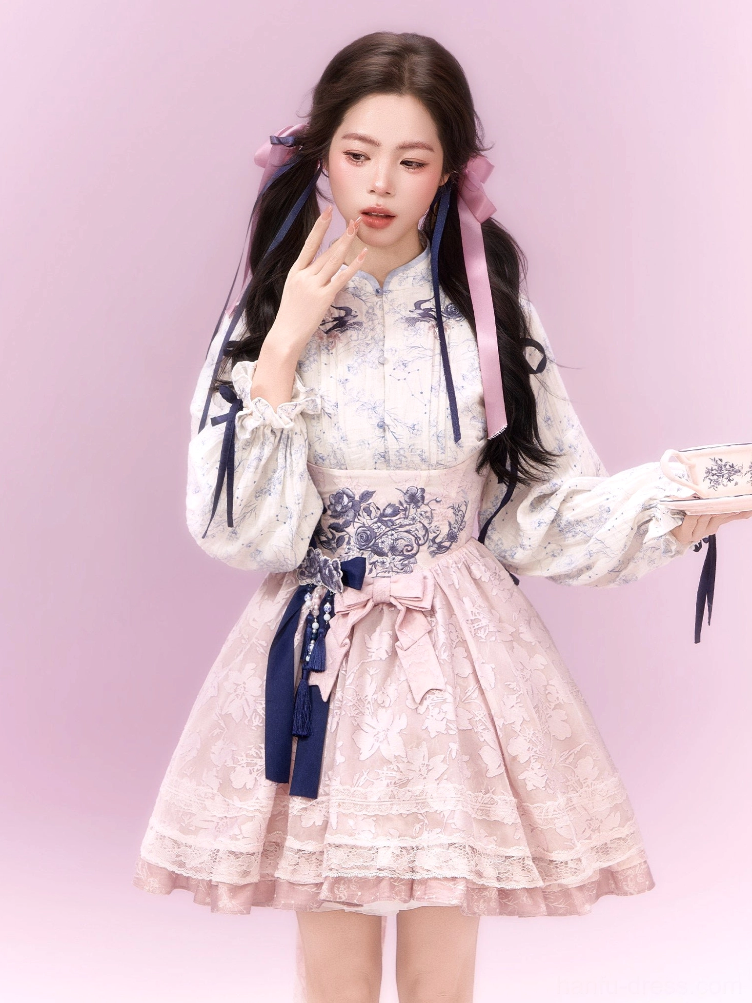 Close-up view of sweet pink modern Hanfu xianxia Lolita dress showing floral waist embroidery and delicate layered details