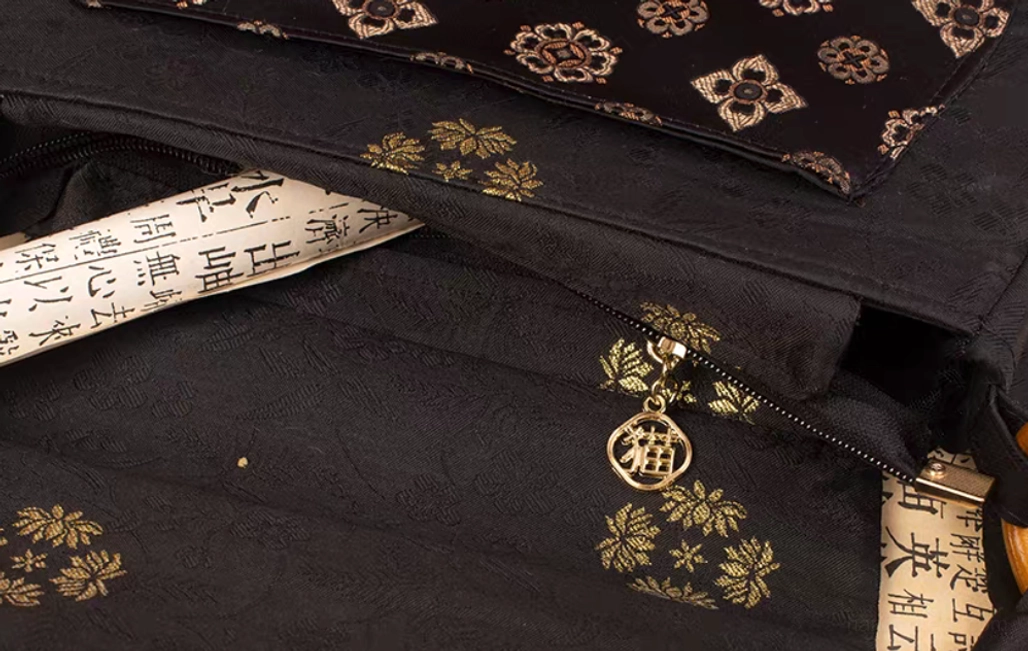 Interior view of Tang Dynasty inspired Chinese crossbody bag with hidden zipper pocket and traditional calligraphy print lining