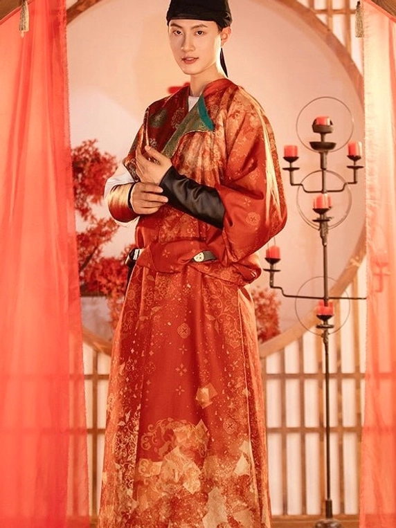 Front full-body view of Tang Dynasty groom formal wedding hanfu with reddish-orange floral robe teal collar black belt and arm guards