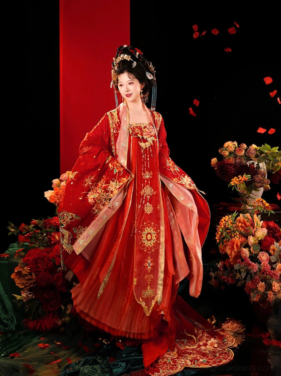 Full-length Tang Dynasty Hanfu bridal gown with flowing scarlet skirt, wide sleeves, golden circular embroidery, long train, and traditional hair accessories