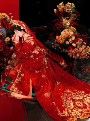 Tang Dynasty Hanfu bridal wedding gown in scarlet red with golden phoenix and floral embroidery, long trailing train, red bridal veil, and elaborate traditional Chinese hair ornaments