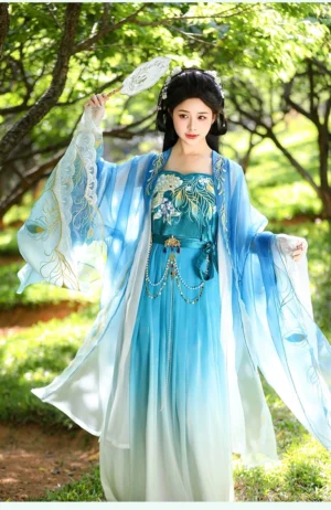 Front full-body view of a Tang-inspired Hanfu dress with peacock embroidery, oversized sleeves, blue to ivory gradient fabric, and a flowing floor-length skirt