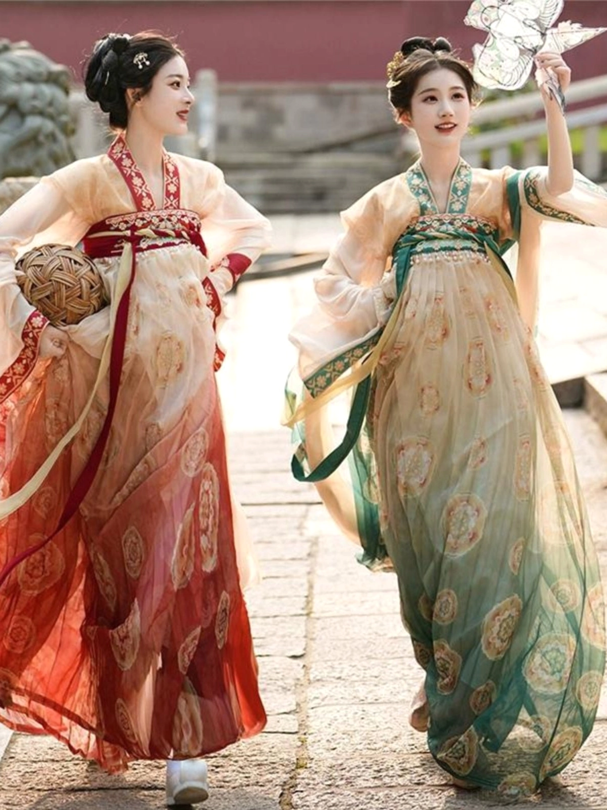 Dynamic side view of Tang Dynasty Hanfu dresses with long decorative ribbons, gradient skirts, and flowing sleeves in a historic courtyard