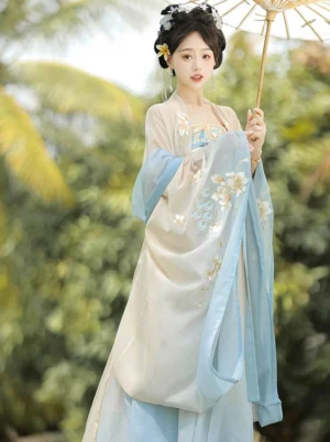 Tang Dynasty style Hanfu Heziqun complete set with cream and light blue colors, floral embroidery, wide chiffon sleeves, and traditional-inspired flowing silhouette