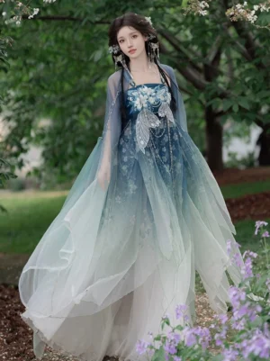 Three quarter front view of Tang Dynasty Hanfu Heziqun dress set with embroidered camisole top, translucent shawl, blue gradient long skirt, and elegant traditional Chinese hairstyle