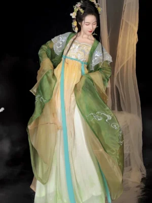 Three-quarter view of an elegant Tang Dynasty style Hanfu Heziqun outfit with green floral embroidered sleeves cyan trim and flowing gradient chiffon skirt