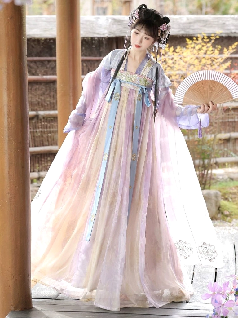 Side view of a Tang Dynasty style Qixiong Ruqun Hanfu outfit with embroidered blue waist sashes sheer shawl and folding fan on a wooden veranda