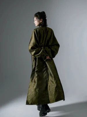 Back view of a long Tang-style hanfu robe showing the gathered waist, floor-length hem, and tonal jacquard fabric texture