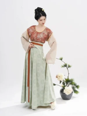 Tang Dynasty Hanfu set in rust red printed beizi overlay with beige round collar top and light green eight-panel skirt front view