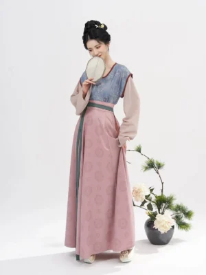 Tang Dynasty Hanfu outfit with slate blue printed beizi, beige inner top and dusty pink flowing skirt shown in three-quarter view
