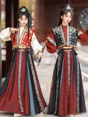 Two models wearing matching Tang Dynasty hanfu swordsman outfits with embroidered vests layered skirts and geometric waist trim in a traditional Chinese wooden courtyard