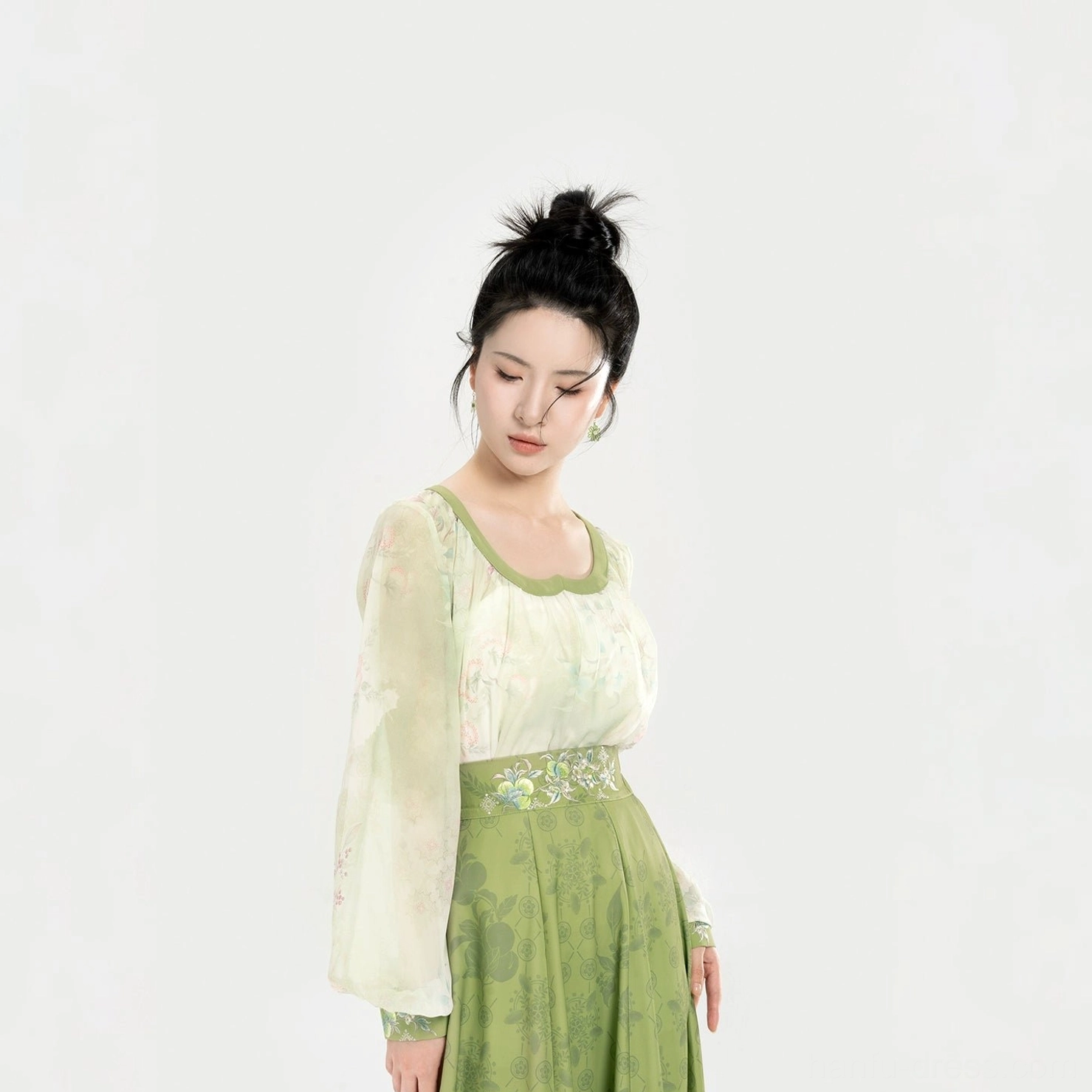 Close-up detail of Tang Dynasty Hanfu top showing the rounded square sweetheart neckline, sheer chiffon fabric, and delicate floral embroidery at the waist
