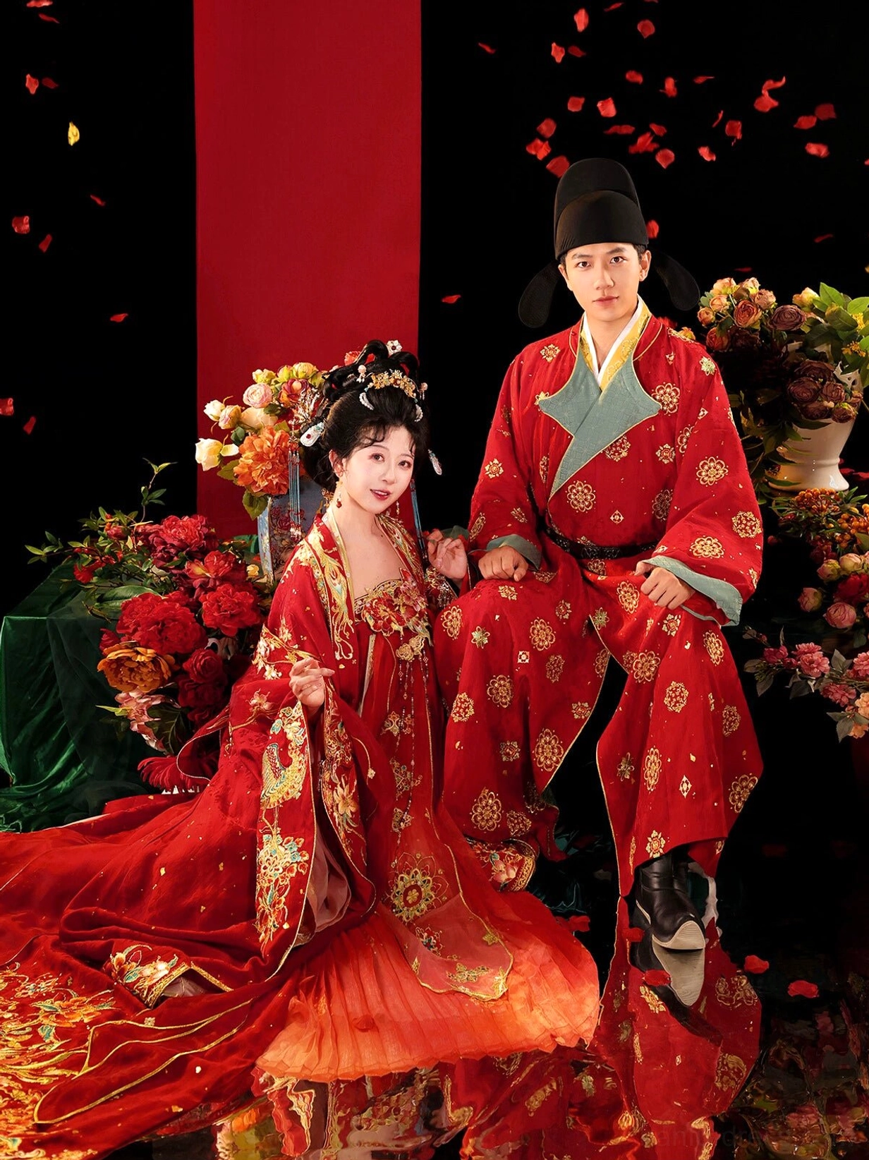 Tang Dynasty Hanfu wedding couple wearing coordinated traditional Chinese bridal and groom outfits in red with golden embroidery and ceremonial styling