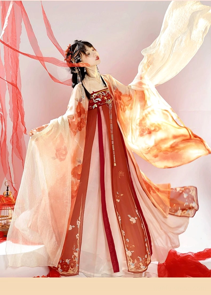 Back three-quarter view of a Tang Dynasty Hanfu wide-sleeve coat in cream and red gradient fabric with floral embroidery along the skirt hem