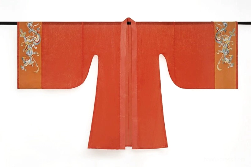 Flat lay display of terracotta orange Tang Dynasty Hanfu wide-sleeve coat with traditional T-shaped cut and colorful embroidered cloud patterns on the cuffs
