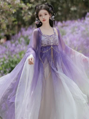 Angled front view of a Tang Dynasty-inspired Hezi Hanfu wrap dress with flowing gradient skirt, translucent wide sleeves, and decorative tassel waist chains