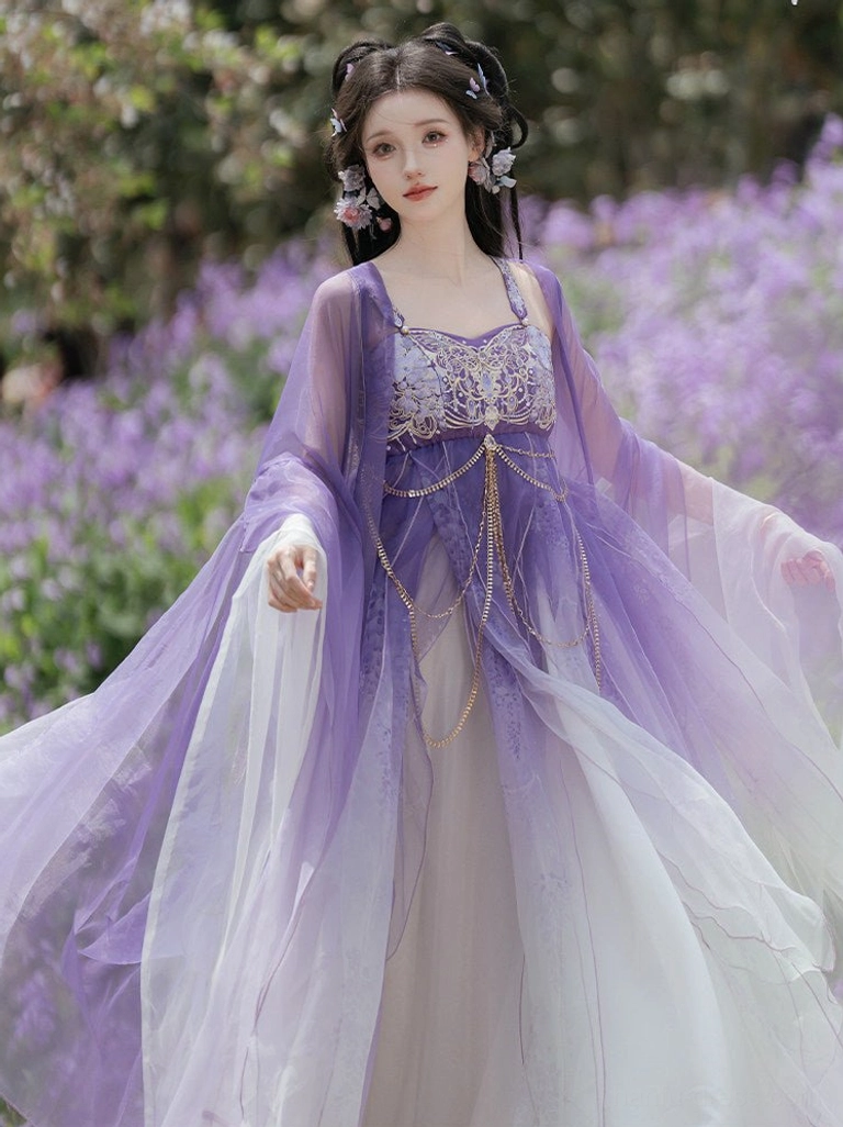 Angled front view of a Tang Dynasty-inspired Hezi Hanfu wrap dress with flowing gradient skirt, translucent wide sleeves, and decorative tassel waist chains