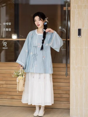 Tang Dynasty inspired blue embroidered Hanfu top and white tiered cotton skirt full set front view with flower basket