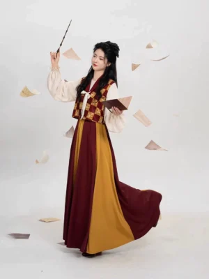 Tang Dynasty inspired modern Hanfu full set shown in side view with cream puff sleeve top patterned beizi vest and flowing burgundy yellow eight-panel skirt
