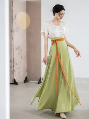 Tang Dynasty inspired Hanfu beizi top and avocado green pleated wrap skirt set shown in a front full-body view