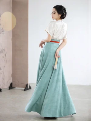 Back view of Tang Dynasty inspired Hanfu outfit with off-white beizi top, cyan wrap skirt, and red waist sash