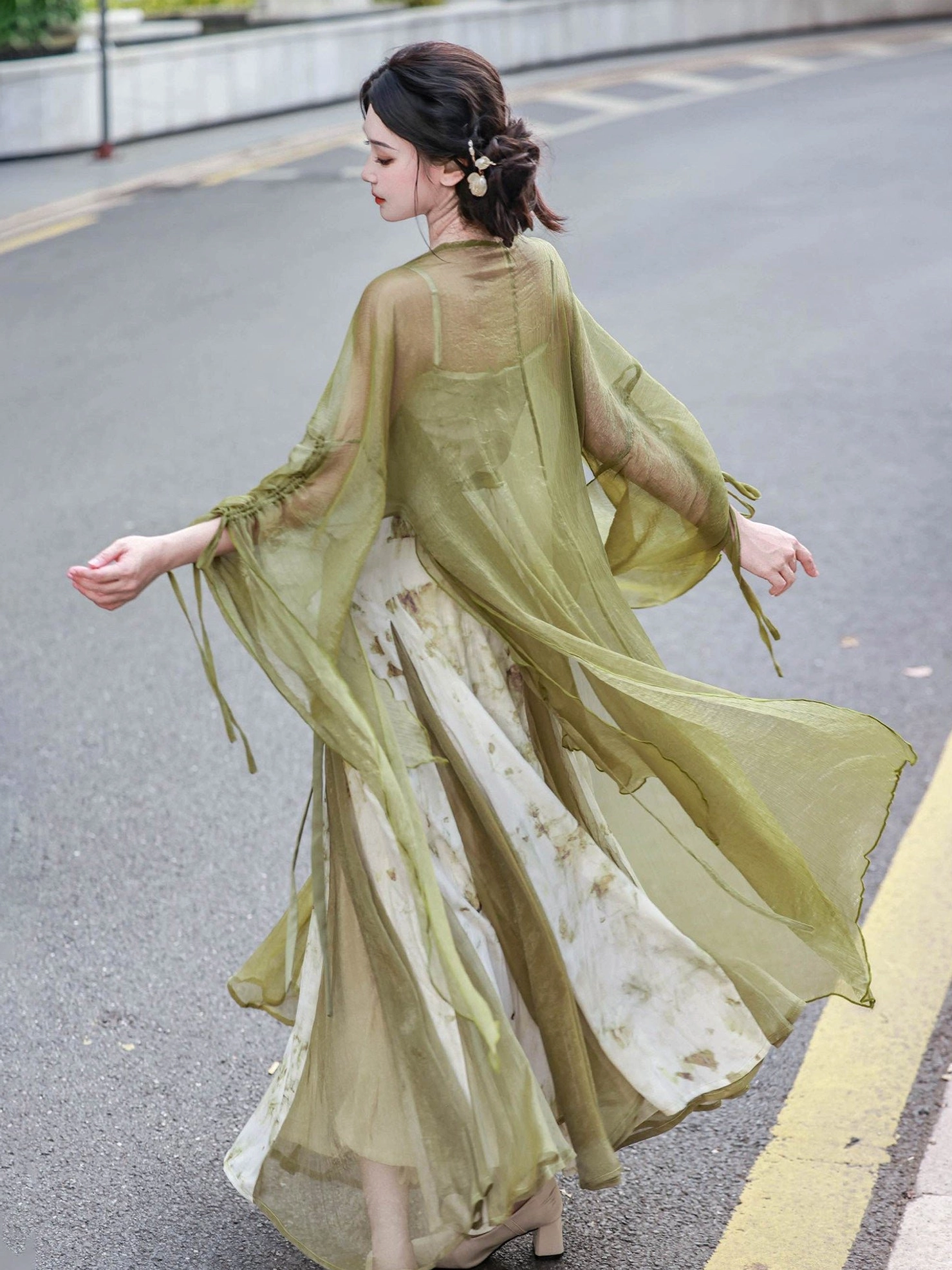 Side back view of flowing Tang Dynasty inspired Hanfu swing dress and olive green fairy cardigan with gathered drawstring cuffs