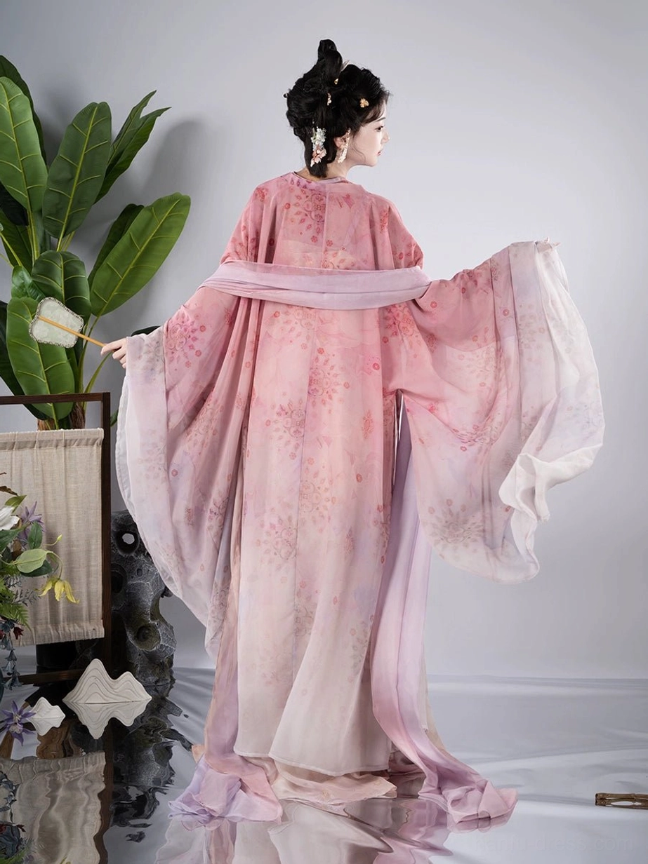 Back view of flowing Tang Dynasty Qixiong Ruqun Hanfu with pink floral chiffon outer robe, matching sash, and long floor length skirt