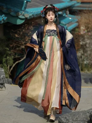 Tang Dynasty Qixiong Ruqun Hanfu complete set in deep blue with embroidered wide sleeves and color-blocked skirt, modeled in a traditional Chinese courtyard