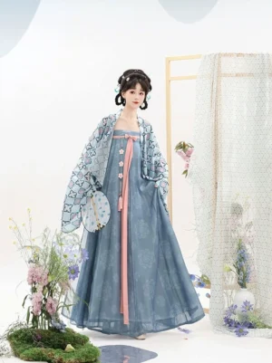Tang Dynasty Qixiong Ruqun Hanfu set in blue with a wide-sleeve cardigan, sky-blue high-waisted dress, pink sash, and floral styling