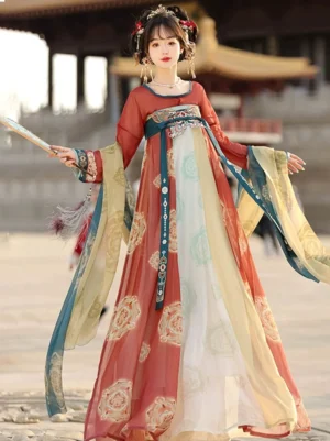 Tang Dynasty Qixiong Ruqun Hanfu shown from the front with red teal cream and yellow color blocking, sheer-look long sleeves, flowing waist ribbons, traditional hair accessories, and a tasseled folding fan