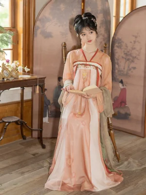 Front full-body view of a Tang Dynasty Qixiong Ruqun Hanfu dress set in peach pink polyester with flowing wrap skirt, decorative waist panel, and traditional Chinese styling