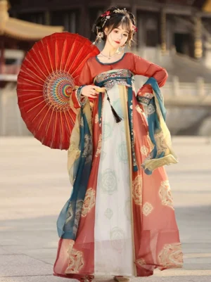 Tang Dynasty Qixiong Ruqun Hanfu complete set shown in a full-body three-quarter front view with color-blocked floral skirt panels, golden flower patterns, embroidered waist trim, flowing silk-style sashes, and a red oil-paper umbrella